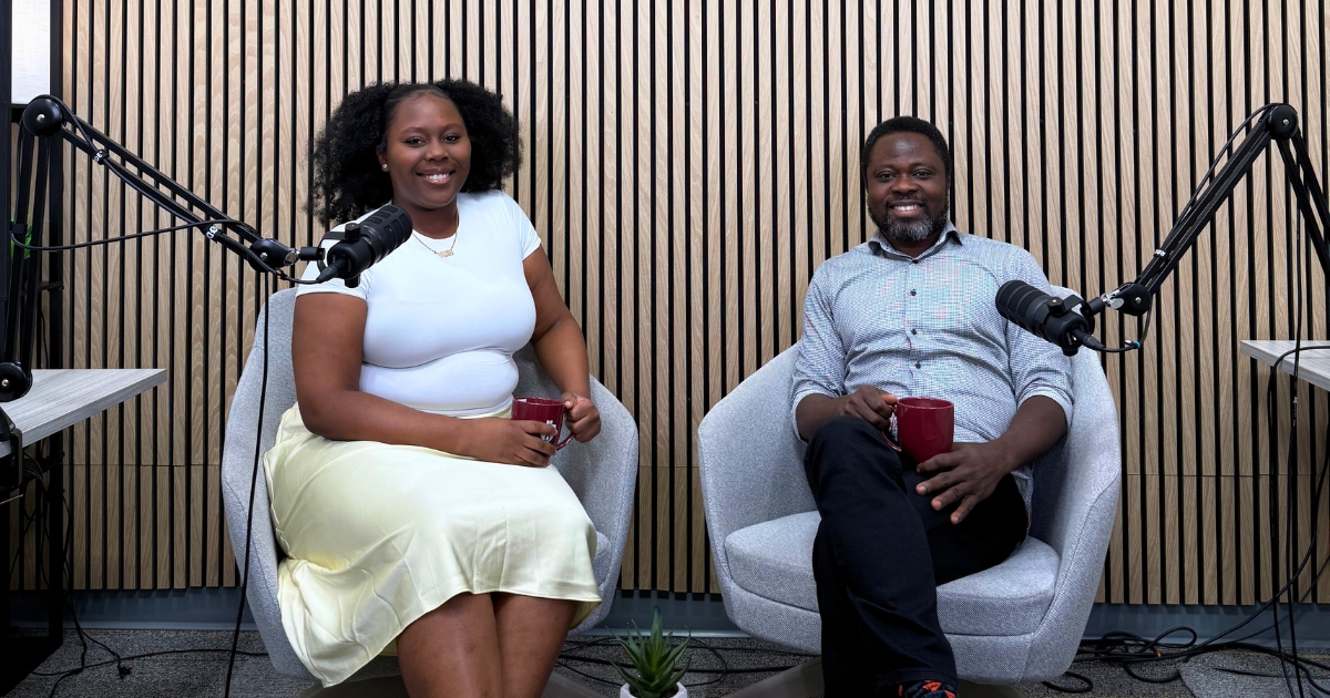 A student and professor sit together in SMU's podcast studio