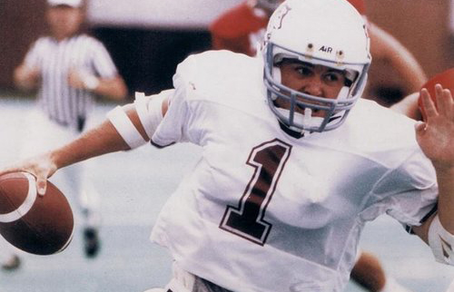 Chris Flynn running with a football.